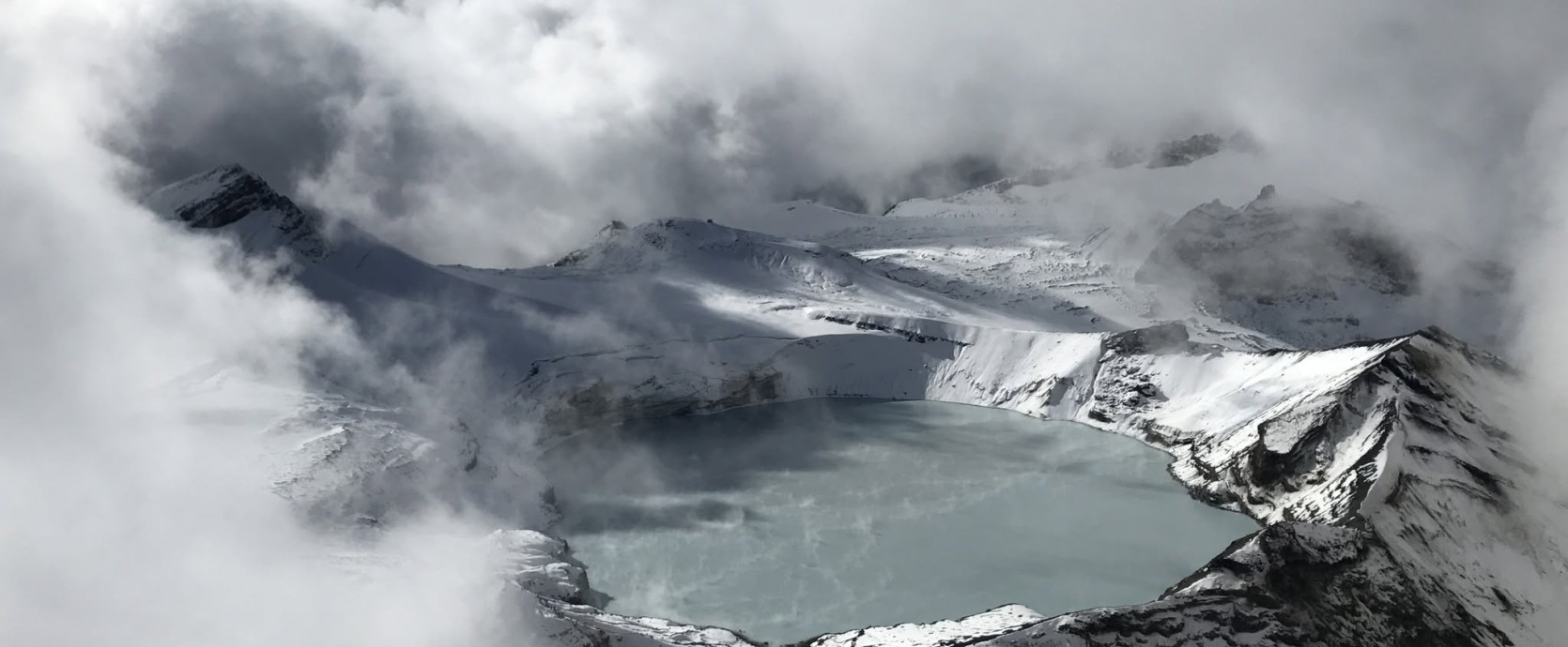 Yif Swery   Ruapehu's Crater Lake breaking through the clouds